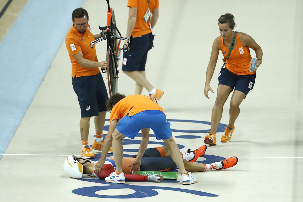 The Netherlands' Joost Van Der Burg lies on the track after falling during the men's Team Pursuit qualifying
