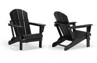 A set of two black Adirondack chairs