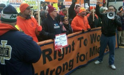 Union members protest ahead of the right-to-work vote in Lansing, Mich., on Dec. 11.