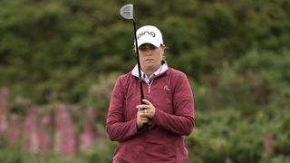 Lauren Coughlin lining up a putt with her Ping Oslo putter