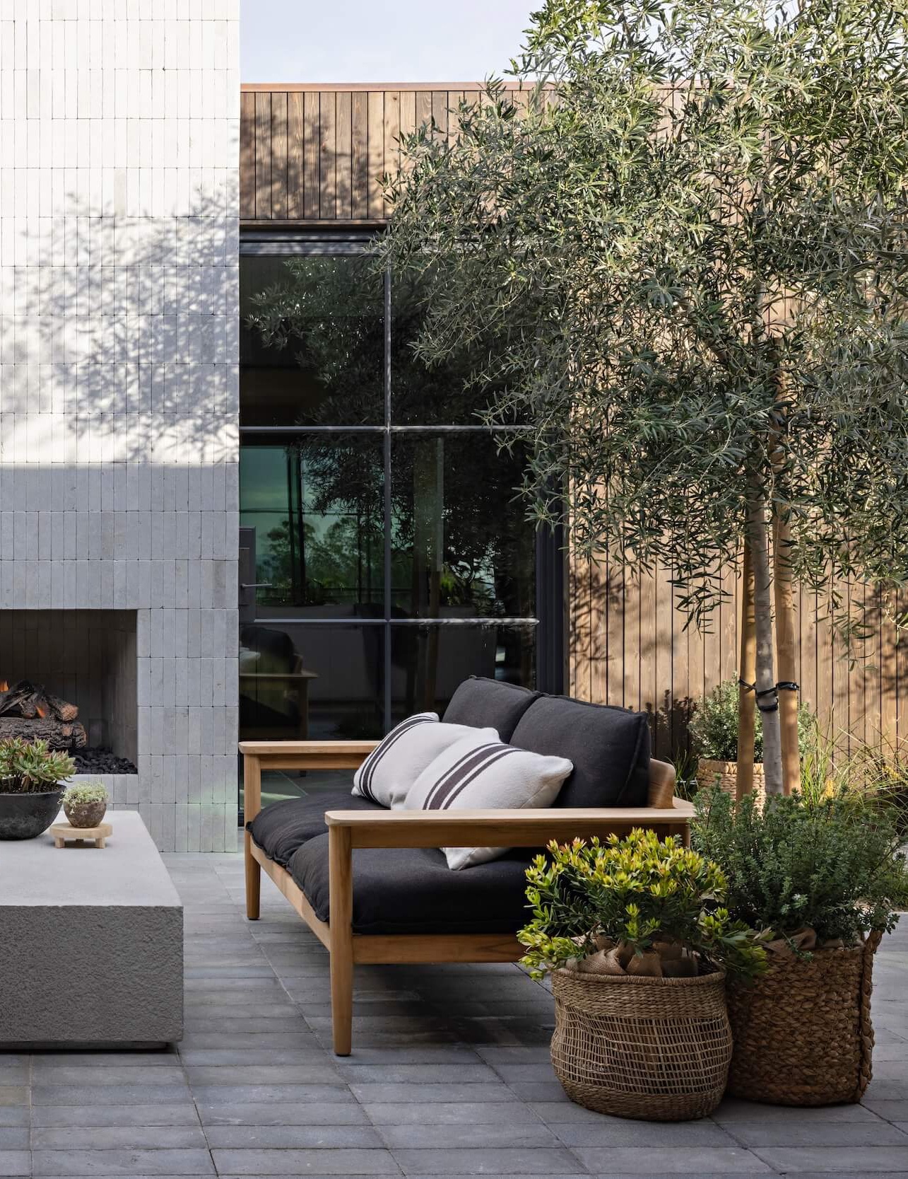 Outdoor living room with rattan basket planters