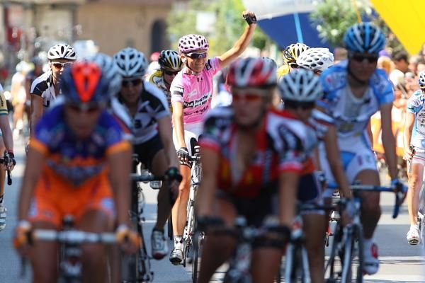Claudia Hausler (Cervelo Test Team) celebrates her overall win as the bunch rolls in