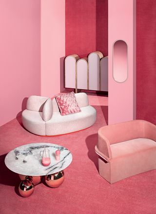 Pink wallpaper and furniture in small room