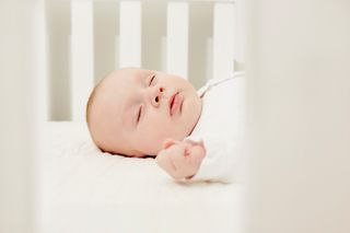 Baby in crib sleeping
