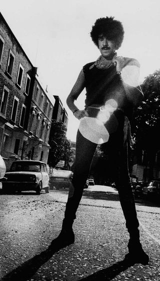 Phil Lynott standing in the street