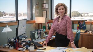 Hannah Hoeard (Felicity Ward) behind her desk in "The Office Australia" coming to Prime Video in October 2024