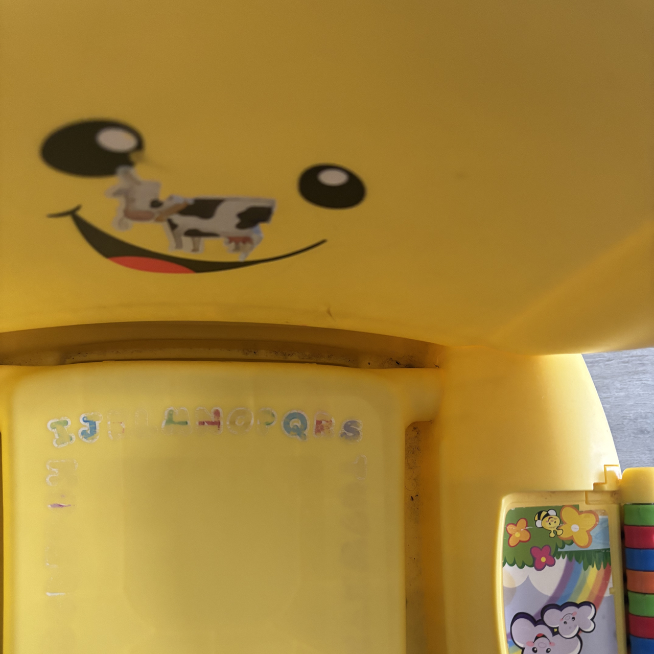 Yellow plastic kids chair before using the Beldray Digital Handheld Steam Cleaner