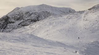 Winter walker on Scafell ridge