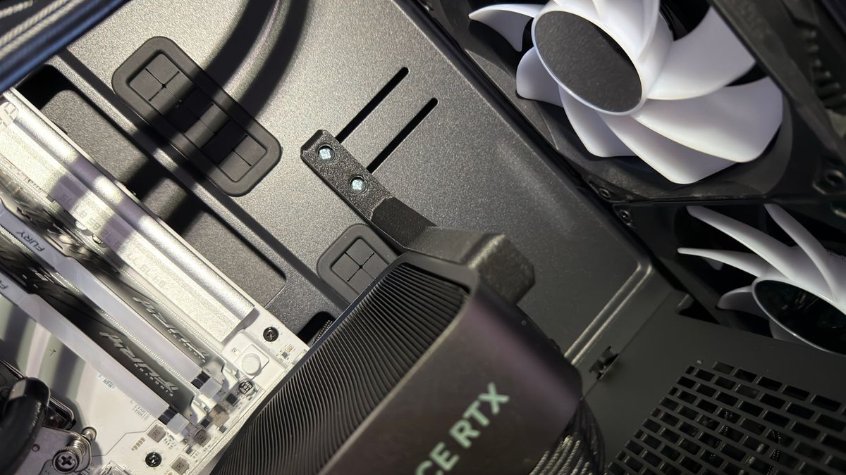 A close-up photo of the GPU mounting bracket inside a Maingear MG-1 Mk.II gaming PC