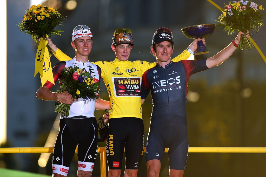 Jonas Vingegaard stands centre stage on the Tour de France podium in Paris 