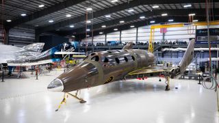 Virgin Galactic's next SpaceShipTwo vehicle, right, stands next to the company's VSS Unity spaceliner, which has already completed two trips to suborbital space.