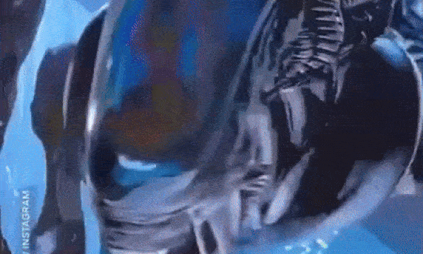 An alien appears to attack Times Square popping out of this 3D billboard. 