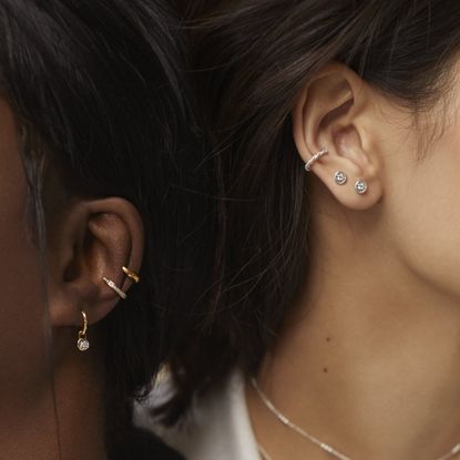 two woman wearing monica vinader jewelry