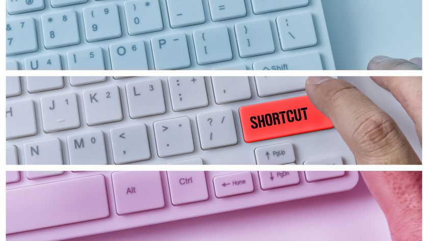 Someone pressing a button that reads 'shortcut' on a white keyboard