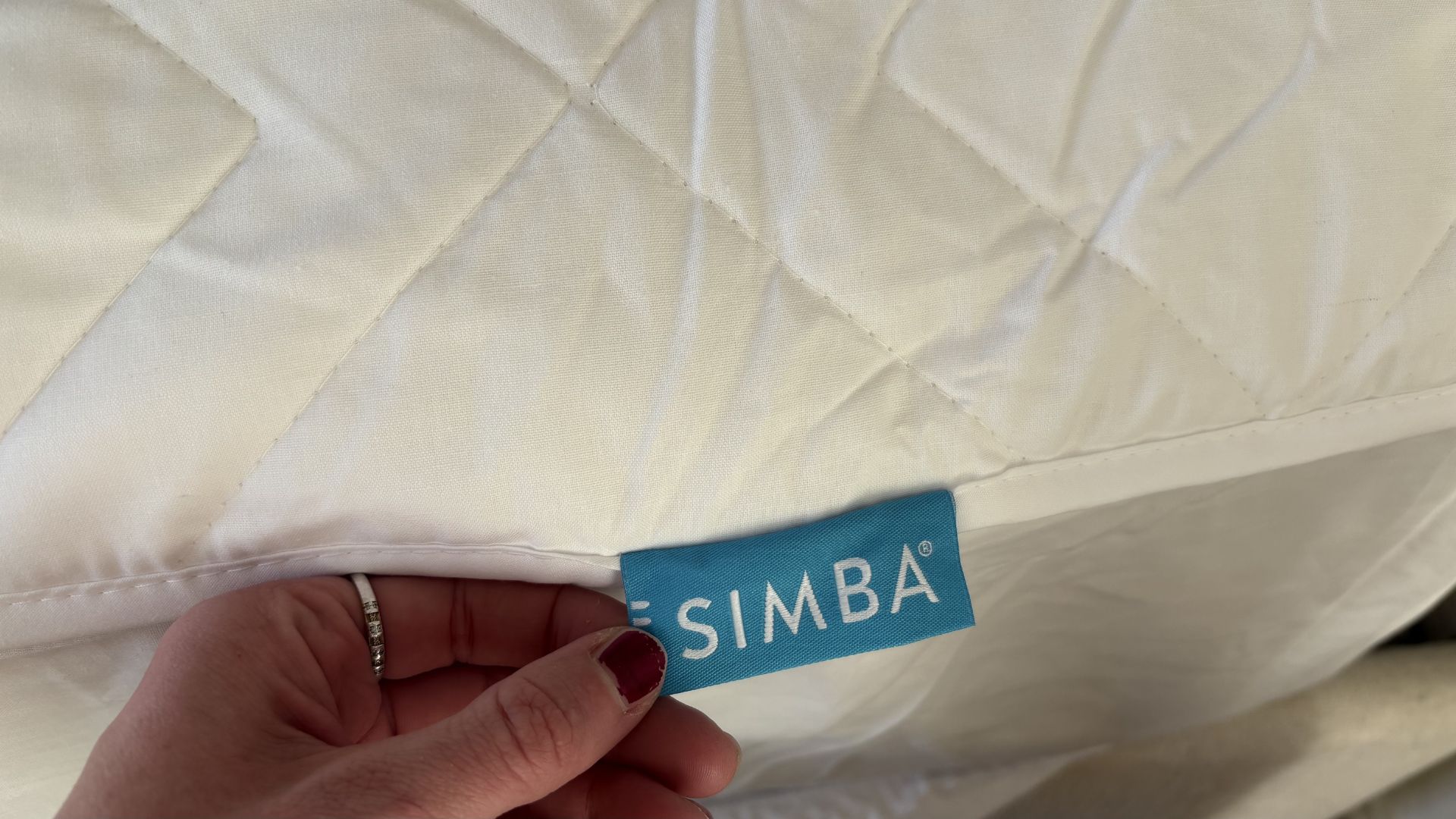 Simba Performance Mattress Protector being tested, on the bed
