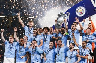 Manchester City players celebrate after winning the Champions League against Inter to complete a treble in 2023.