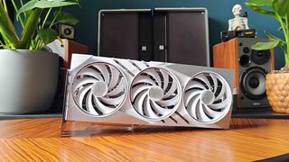 White RTX 4080 Super sitting on its side on woodgrain table