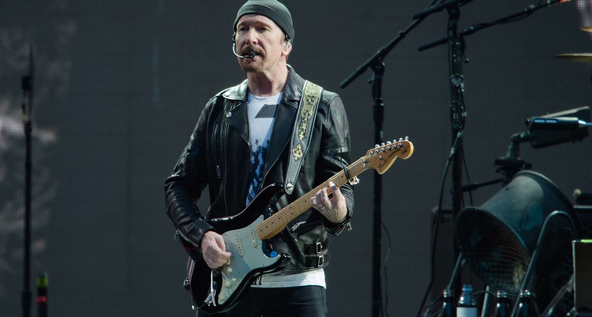 The Edge plays his 1973 Black Strat onstage