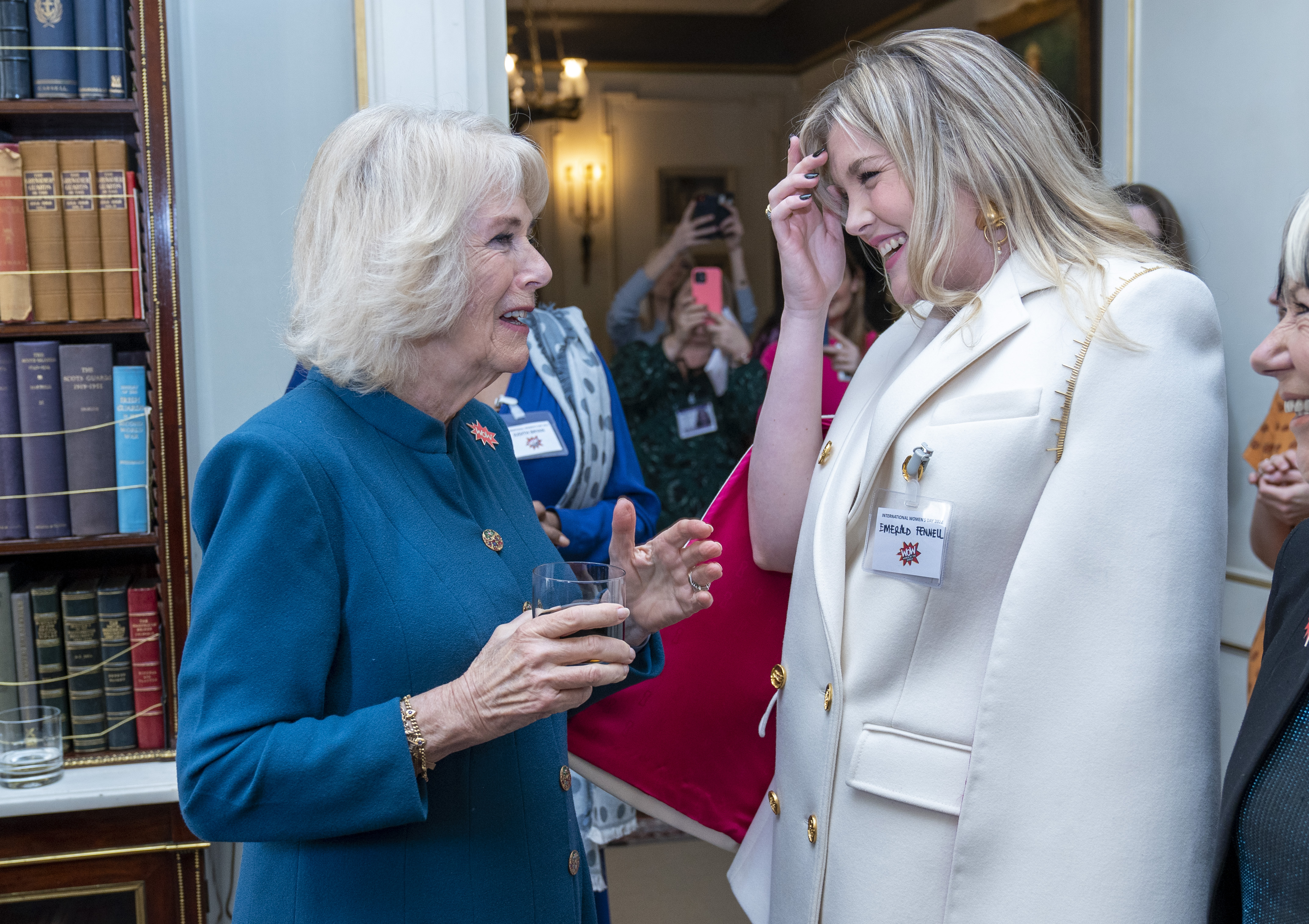 Camilla, Duchess of Cornwall, President of WOW - Women of the World Festival, meets Emerald Fennell as she hosts a reception to mark International Women's Day at Clarence House on March 8, 2022 in London, England.