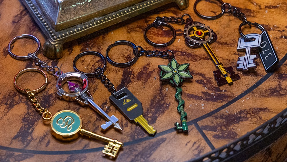 6 individual Blue Prince keychains