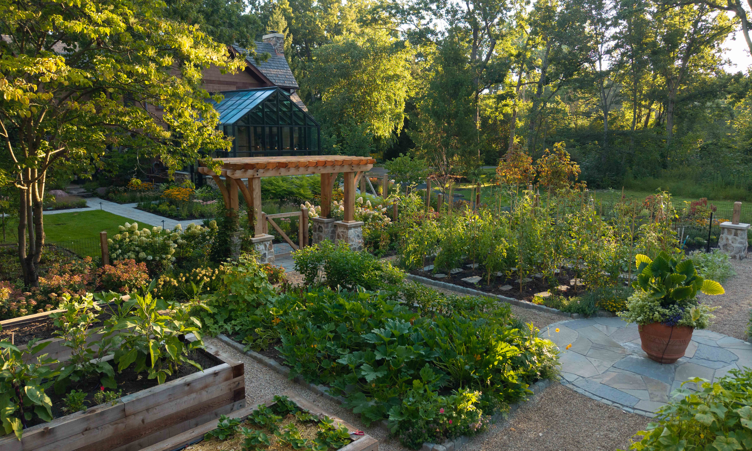 Lush kitchen garden and raised beds full of seasonal vegetables