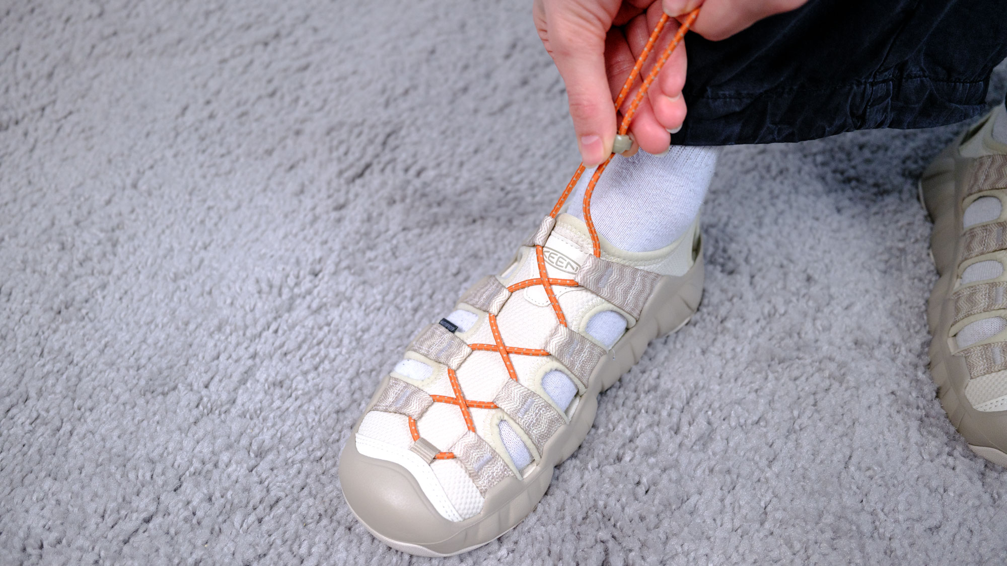 The Keen Hyperport H2 water hiking sandals with aquagrip soles, injected foam soles, and a cinch clasp for slip-on ease, in the taupe/coral colorway