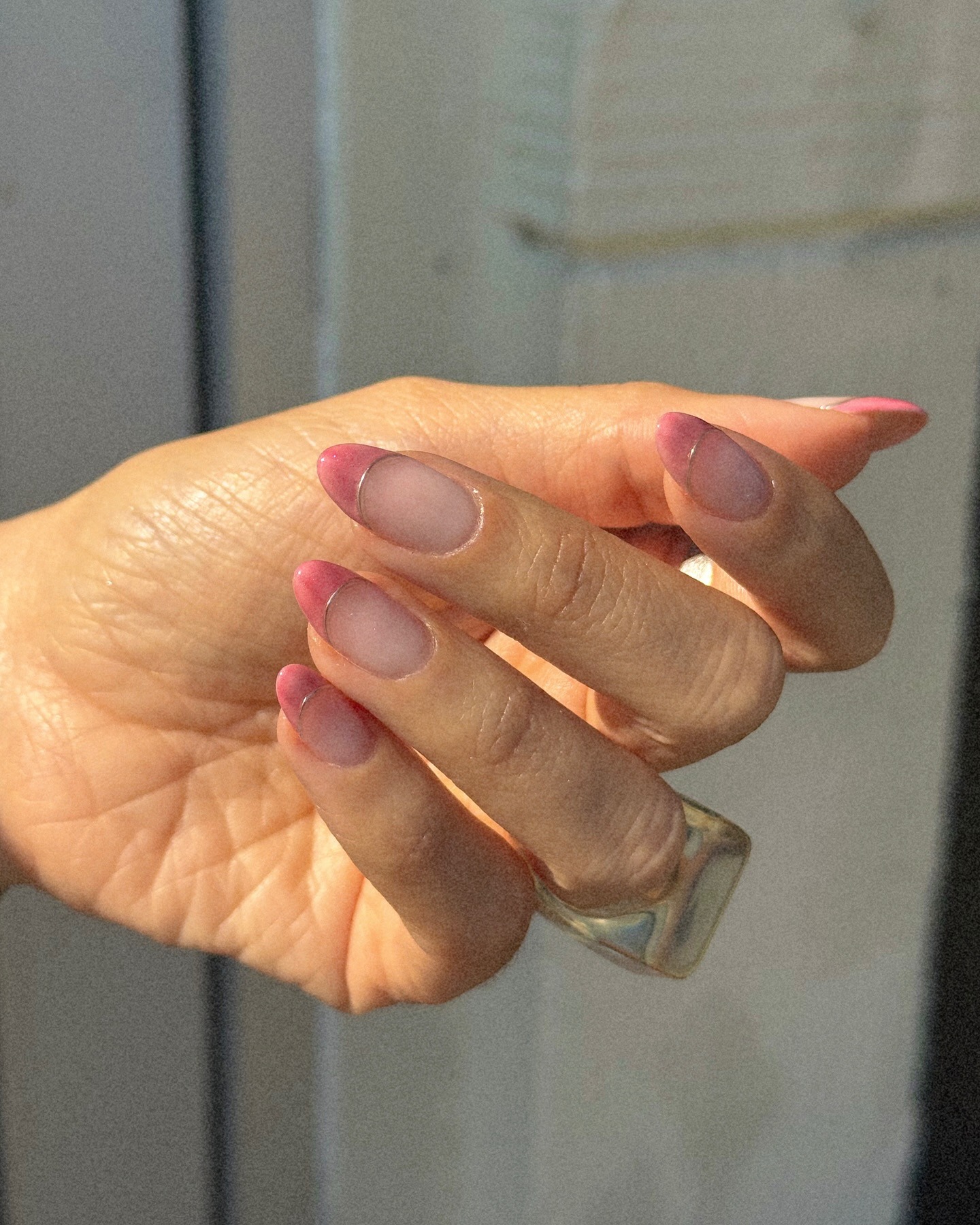 Blush pink French tips with silver lining.