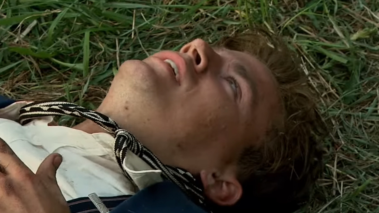 Channing Tatum lying on the grass looking up in Public Enemies.