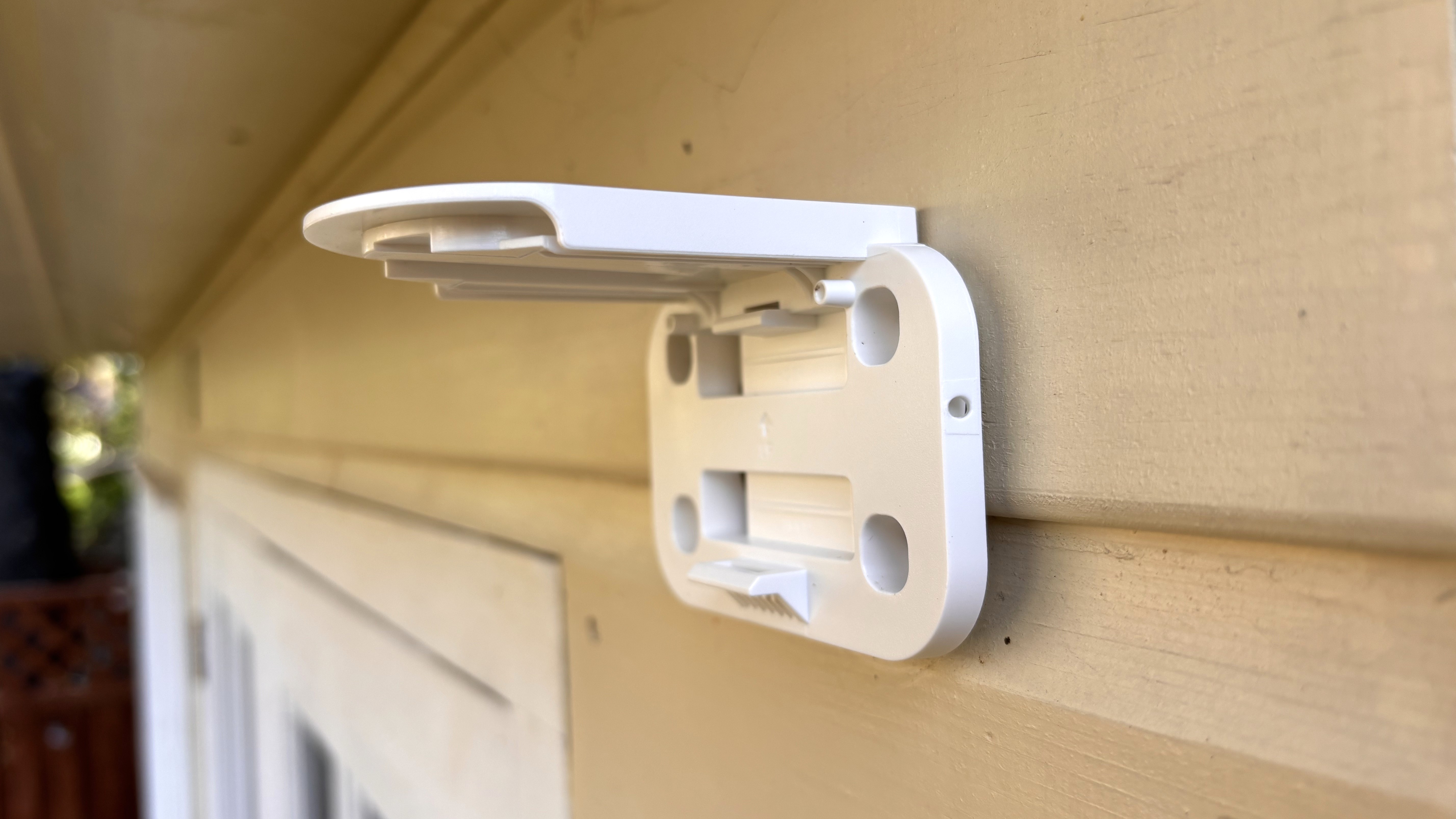Mounting bracket for IMOU AOV PT security camera installed on wall