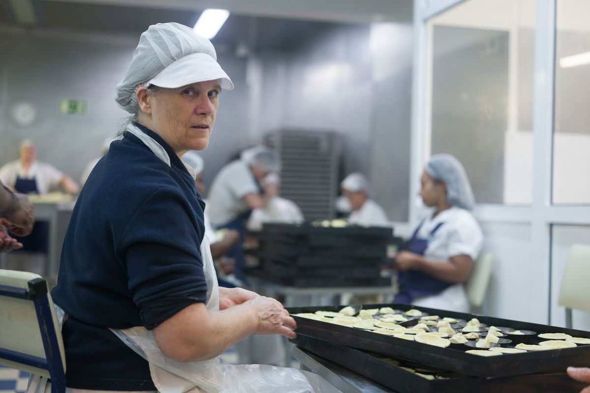 Sigma FP2 sample gallery: worker in a kitchen, making custard tarts
