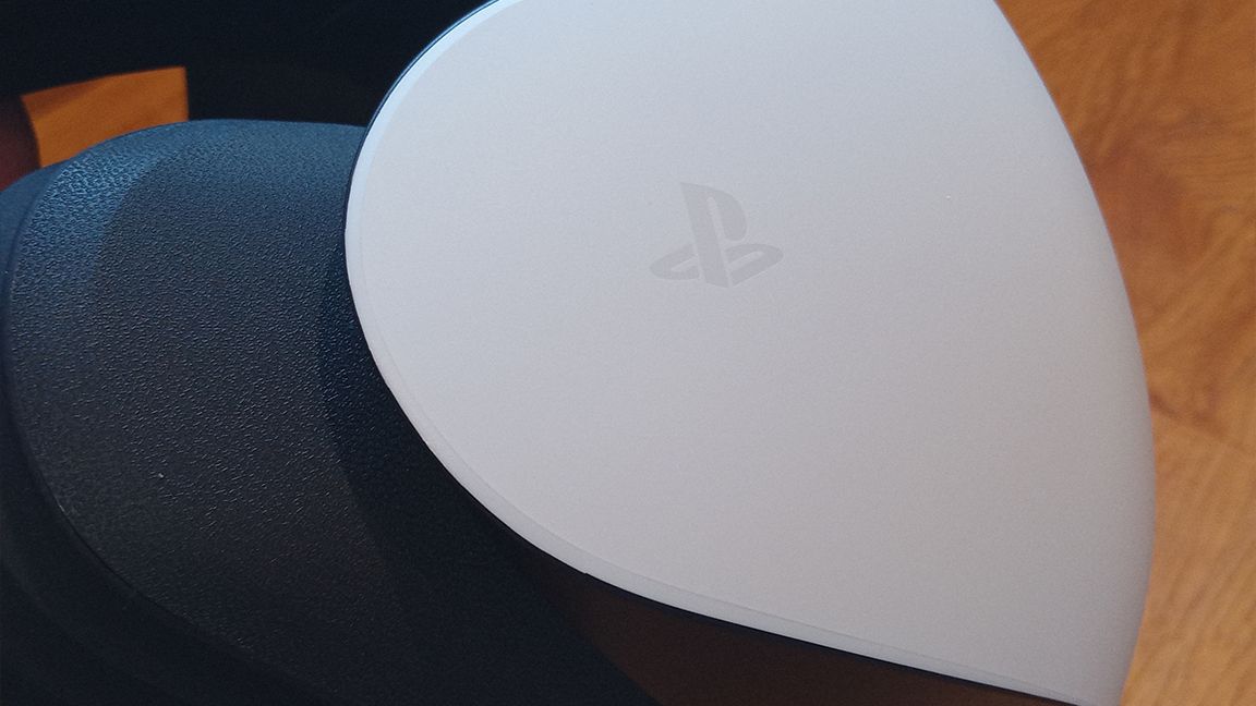 PSVR 2 review; a close up of the PlayStation logo on the side of a VR headset
