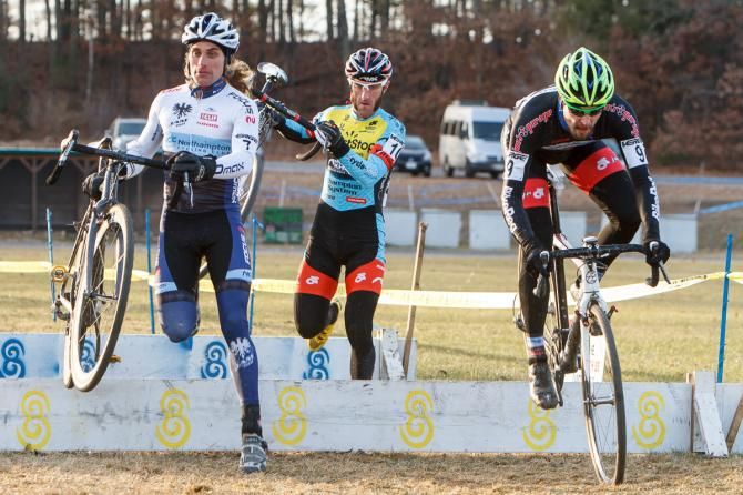 Anthony Clark (NCC/Vittoria), Adam Myerson (Team SmartStop/Mountain Khakis), and Jerome Townsend (BikeReg/Joe's Garage) flying through the barrier section