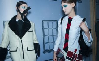 Female models wearing white, red, cream and black clothes from the Thom Browne AW 2016 collection