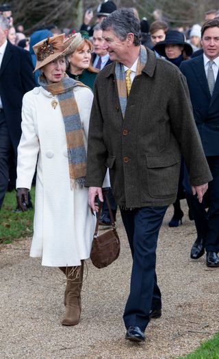 Princess Anne and Sir Timothy Laurence were couple goals in matching scarves