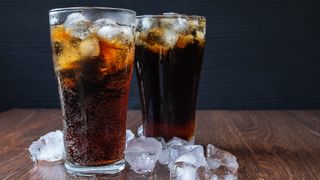 two pint glasses of diet soda with ice