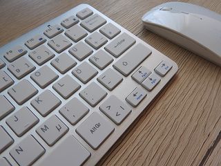 Apple Magic Keyboard And Mouse On Top Of Table