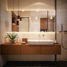 Marble walled bathroom with a wooden counter, ceramic basic, and large mirror