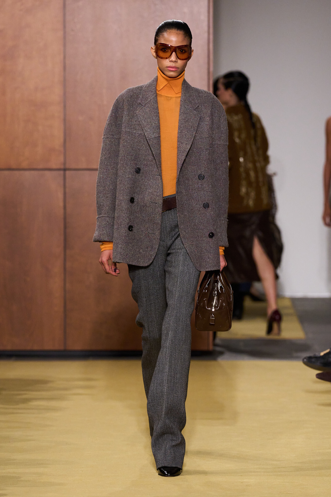 A Tory Burch model walks the fall/winter 2026 runway during NYFW