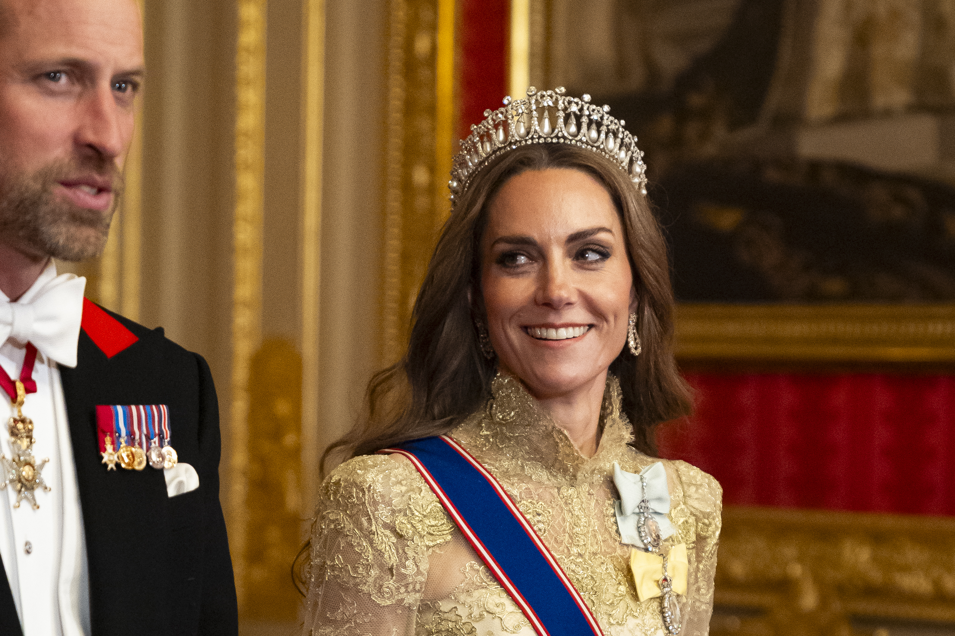 Kate Middleton wearing a tiara and gold gown