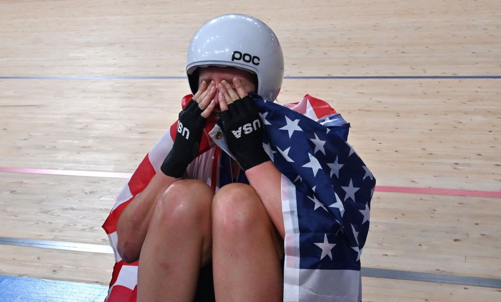 USAs Jennifer Valente poses with a flag after winning the womens track cycling omnium points race during the Tokyo 2020 Olympic Games at Izu Velodrome in Izu Japan on August 8 2021 Photo by Peter PARKS AFP Photo by PETER PARKSAFP via Getty Images