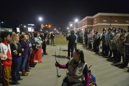 Police and protesters square off in Ferguson, Missouri, on March 11