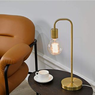 Gold lamp from Amazon on a table