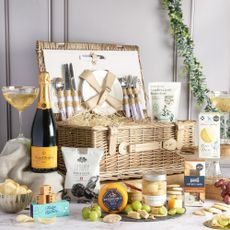 Photo of summer prosecco picnic hamper with wicker basket