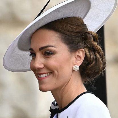 Kate Middleton wearing a white hat and dress at Trooping the Colour 2024