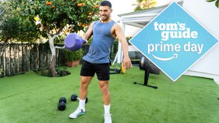 Man outdoors at home swinging a kettlebell in home gym set up