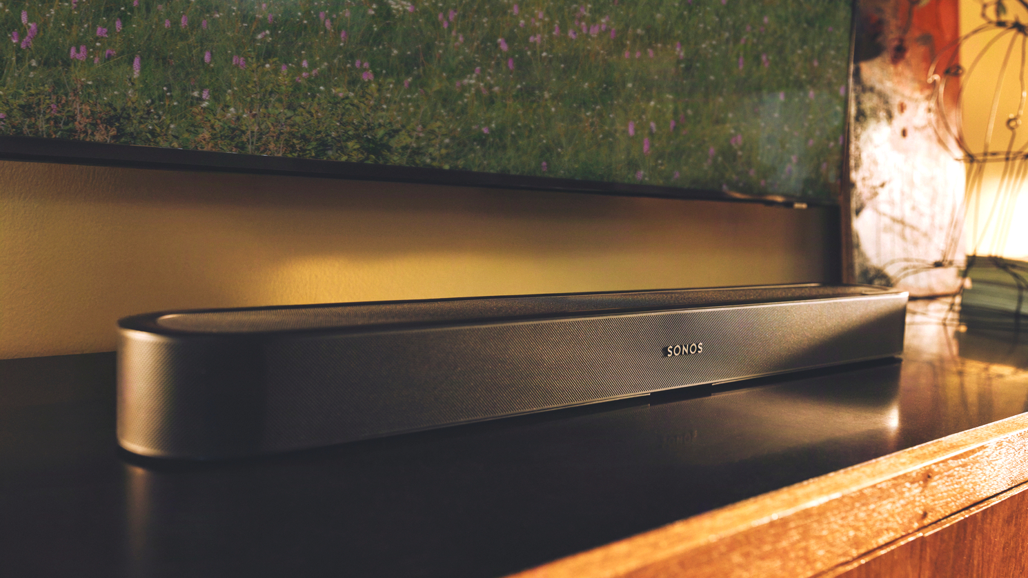 A black Sonos Beam Ultra on an entertainment stand.