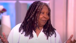 Whoopi Goldberg raising up her hands on The View.