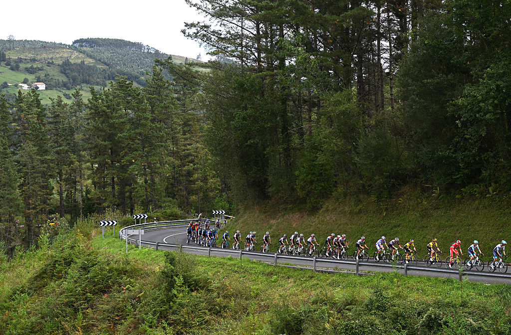 BILBAO, SPAIN - SEPTEMBER 03: A general view of Jay Vine of Australia and UAE Team Emirates - XRG - Polka dot Mountain Jersey, Jonas Vingegaard of Denmark and Team Visma | Lease a Bike - Red Leader Jersey and the peloton passing through a landscape during the La Vuelta - 80th Tour of Spain 2025, Stage 11 a 157.4km stage from Bilbao to Bilbao / #UCIWT / on September 03, 2025 in Bilbao, Spain. (Photo by Dario Belingheri/Getty Images)