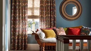 blue living room with patterned curtains