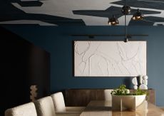 blue dining room with black and white wallpaper on the ceiling